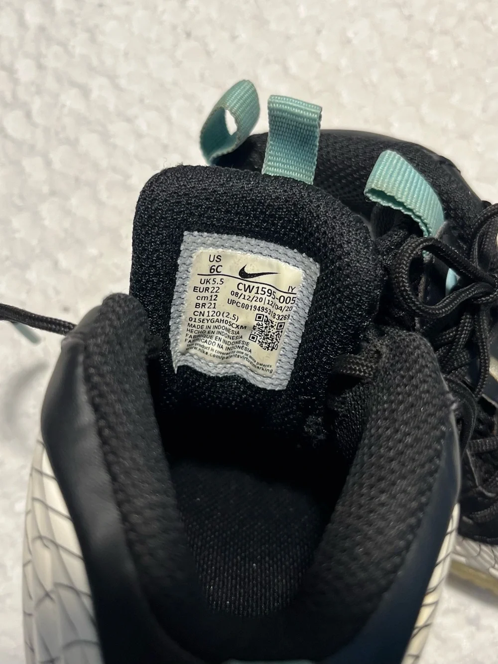 Nike Baby Black and White Grid Wrapped Sneakers with Teal Accents